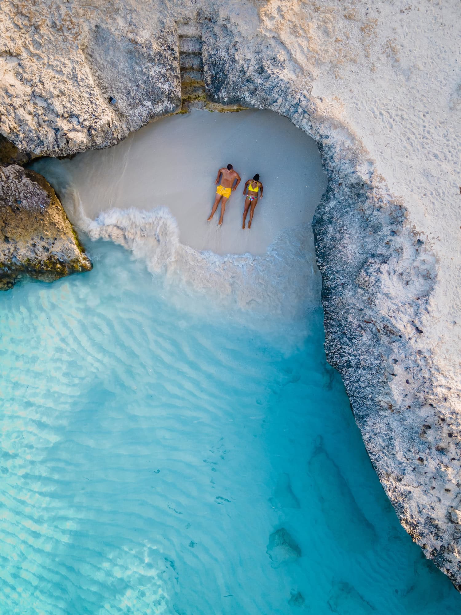 A couple enjoying the beach on their honeymoon