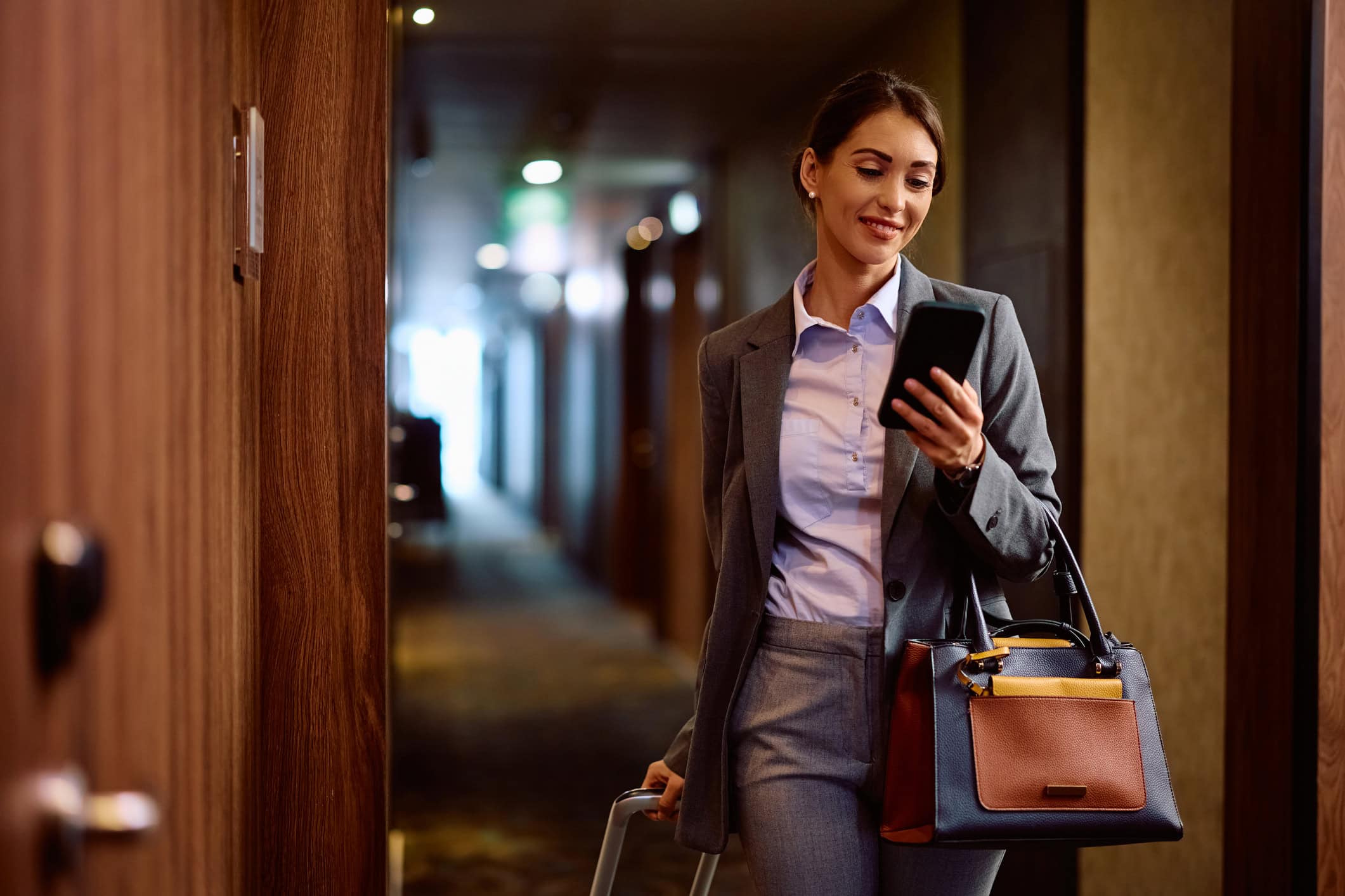 woman checking her phone while traveling