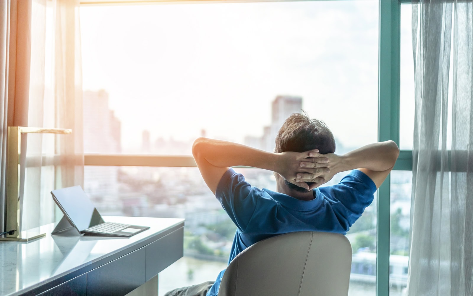 businessman working remotely from a hotel